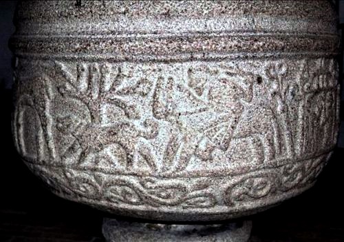 Romanesque baptismal font in Lime Church with hunting scene