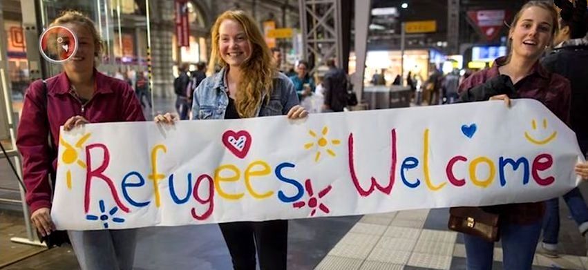 Young girls welcome Muslim immigrants
