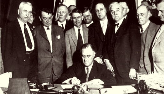 Franklin D. Roosevelt signs the law on the Tennessee Valey Project May 18, 1933