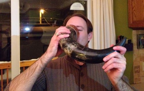 Eric Wentling drinks Minnesota beer from a horn