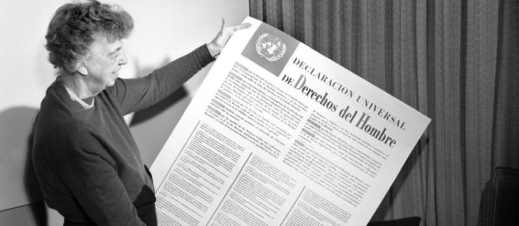 Eleanor Roosevelt in 1948 with a poster with the Universal Declaration of Human Rights